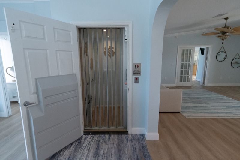 Private elevator with a sliding gate