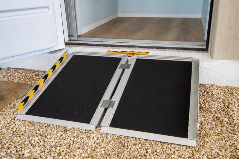 The portable accessibility ramp at the elevator entry
