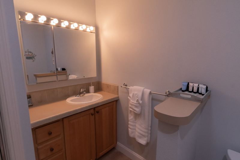 Bathroom vanity with fresh towels and toiletries